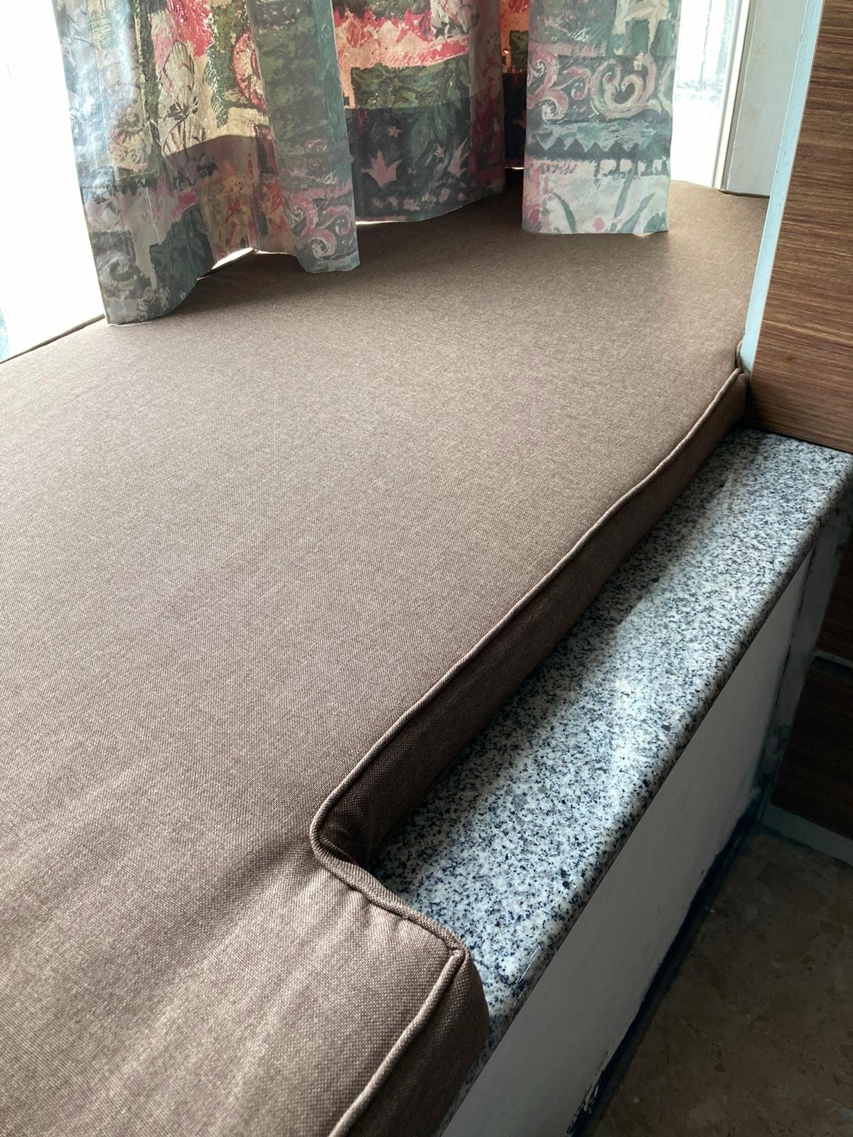 Taupe custom cushion with a cutout on a marble window sill